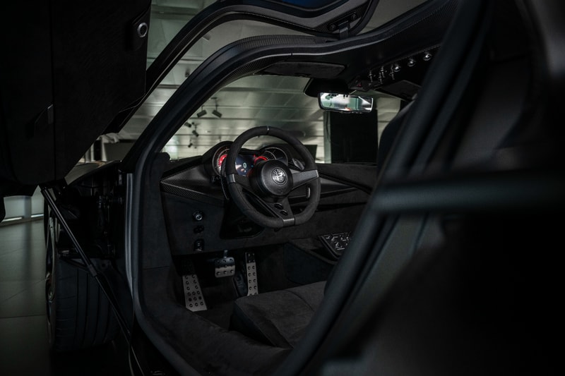 Alfa Romeo 33 Stradale Perla Nera featuring matte black exposed carbon fiber bodywork.