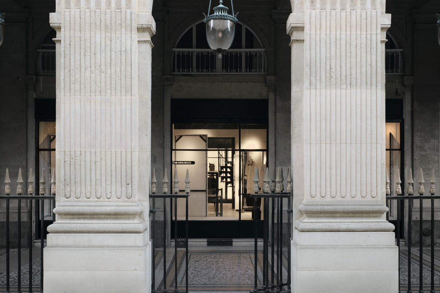 Minimalist interior of the new Ann Demeulemeester Paris flagship store at the Jardin du Palais Royal.