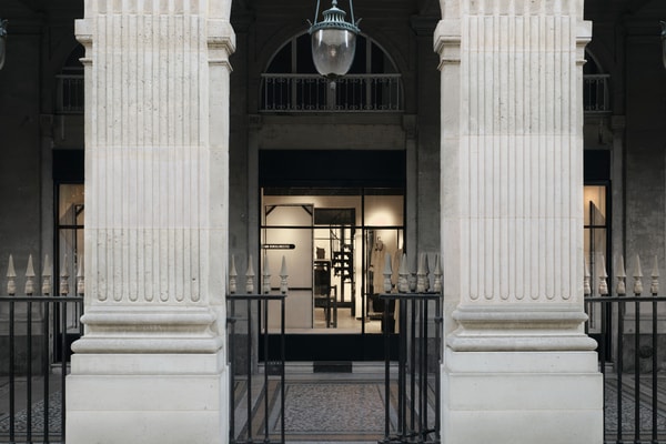 Minimalist interior of the new Ann Demeulemeester Paris flagship store at the Jardin du Palais Royal.