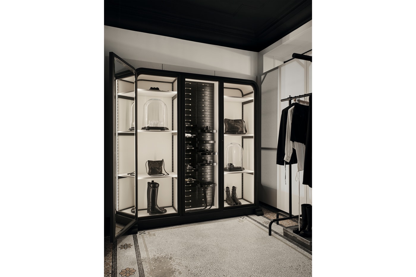 Minimalist interior of the new Ann Demeulemeester Paris flagship store at the Jardin du Palais Royal.