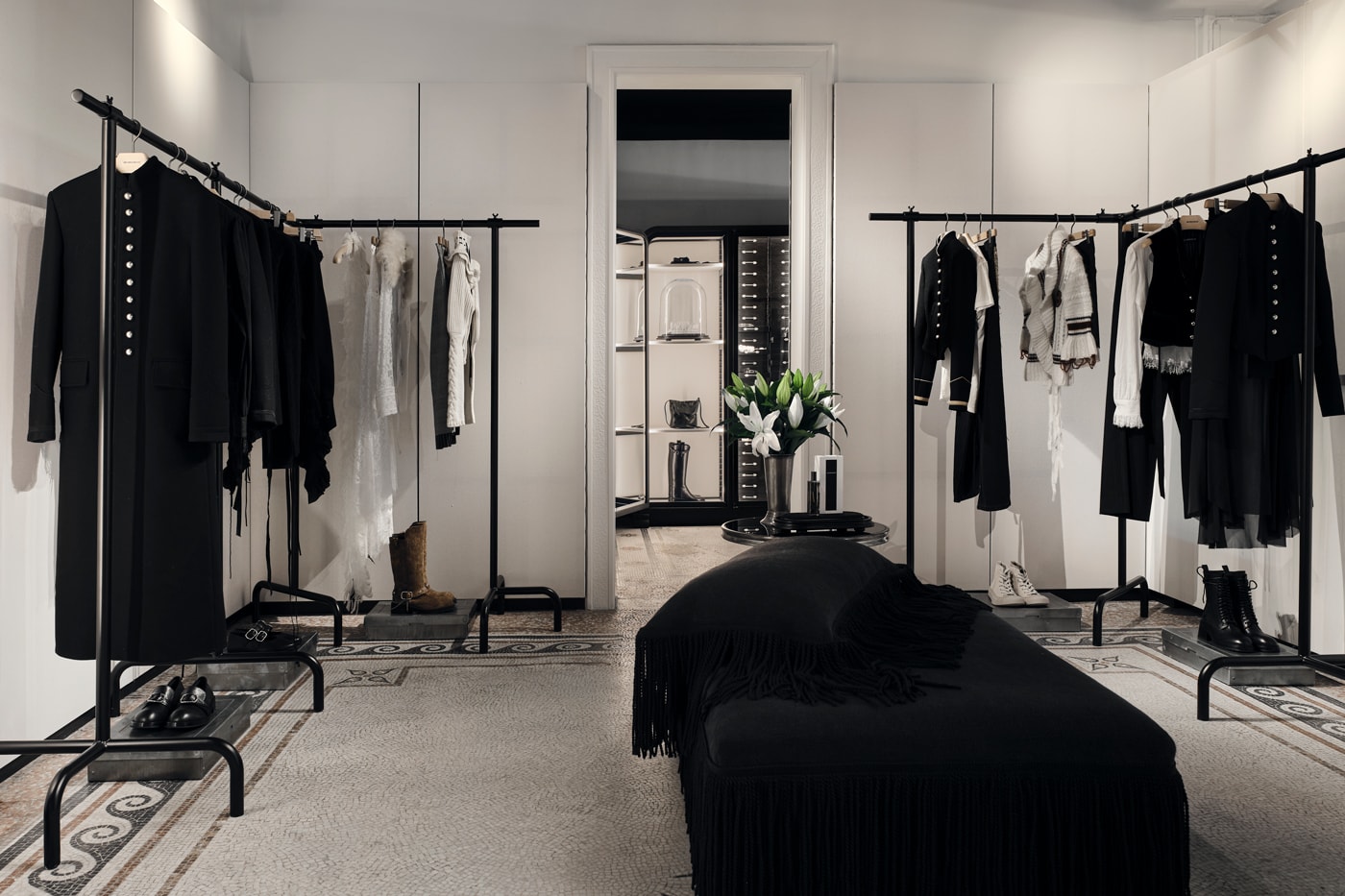 Minimalist interior of the new Ann Demeulemeester Paris flagship store at the Jardin du Palais Royal.