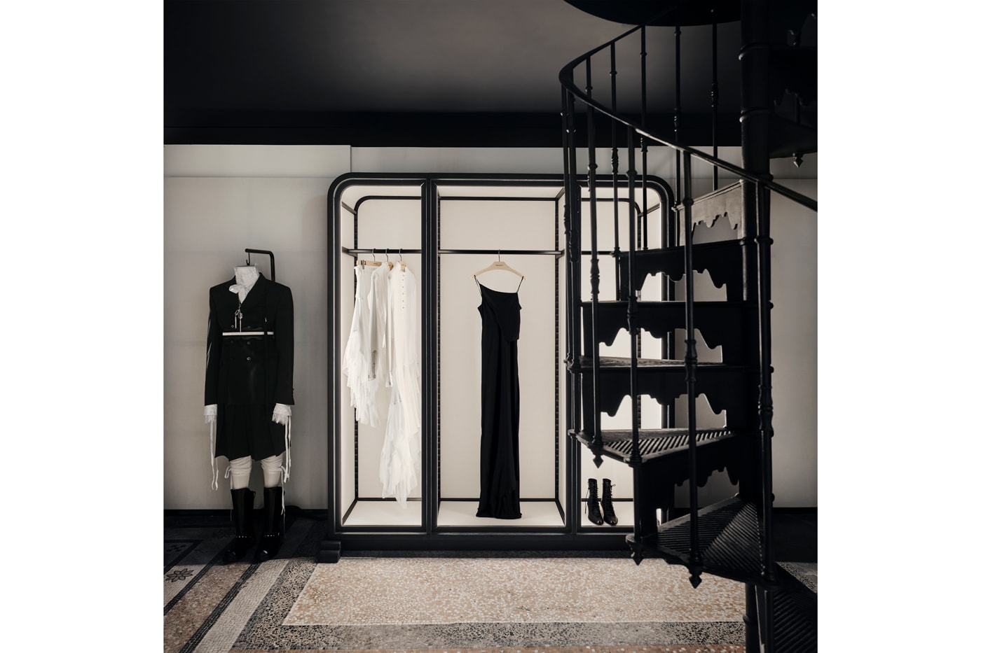 Minimalist interior of the new Ann Demeulemeester Paris flagship store at the Jardin du Palais Royal.