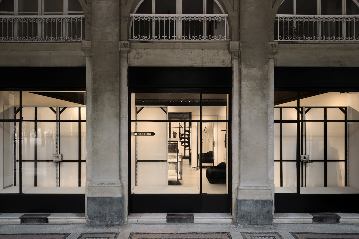 Minimalist interior of the new Ann Demeulemeester Paris flagship store at the Jardin du Palais Royal.