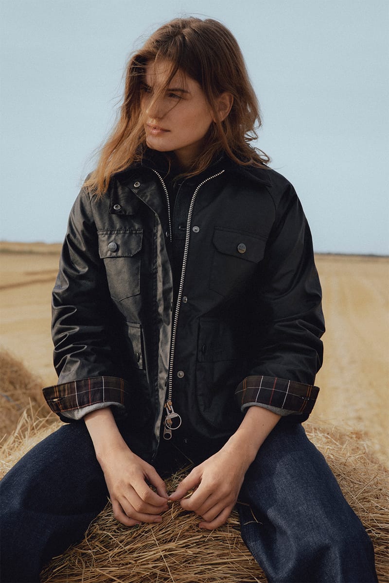 A.P.C. x Barbour tartan shirt tucked into dark denim jeans campaign photograph