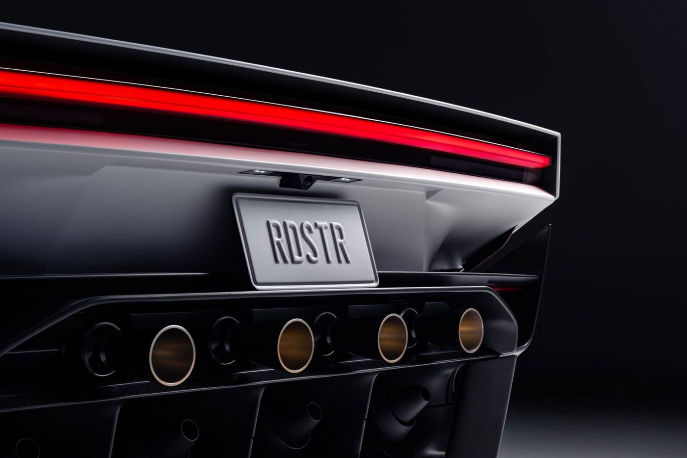 Tesla and SpaceX Put Thrusters on the Roadster so It Can Literally Fly elon musk electric vehicles backflips ramp upside down two-seat