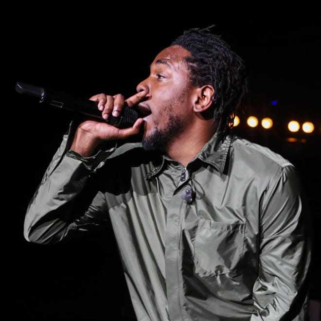 Watch Kendrick Lamar Bring Fans up on Stage to Perform "m.A.A.d city" With Him