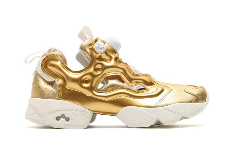 gold reebok pumps