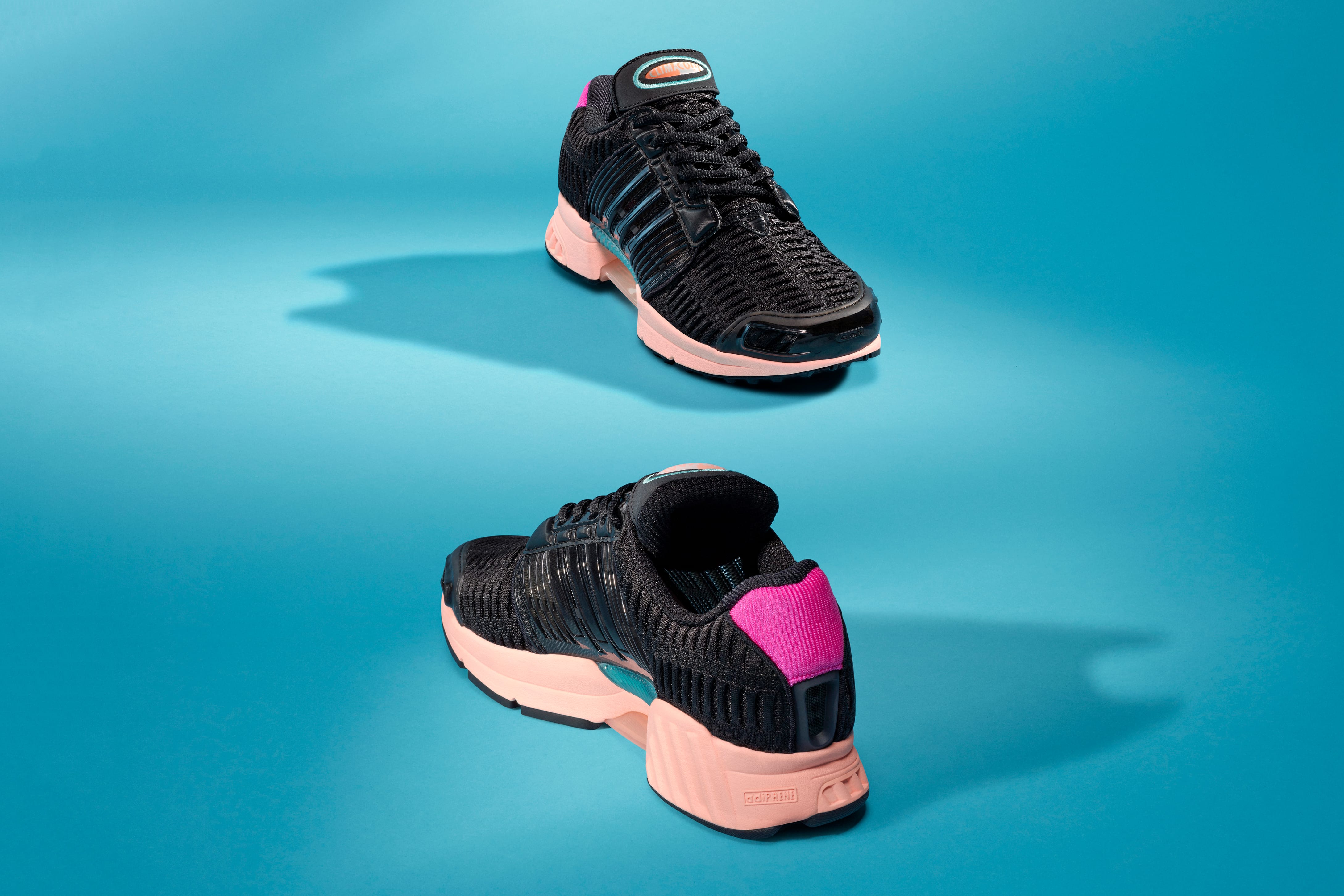 black adidas with pink soles