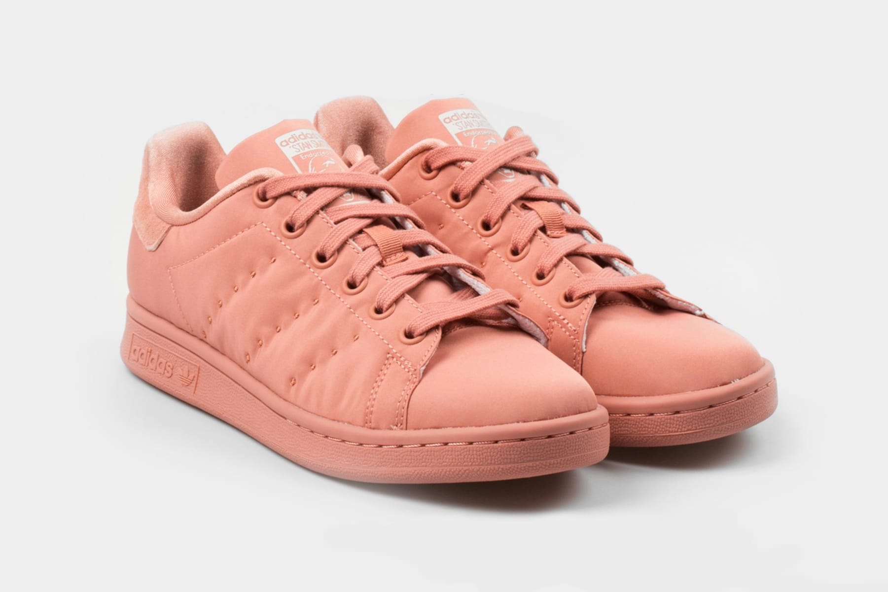 rose color sneakers