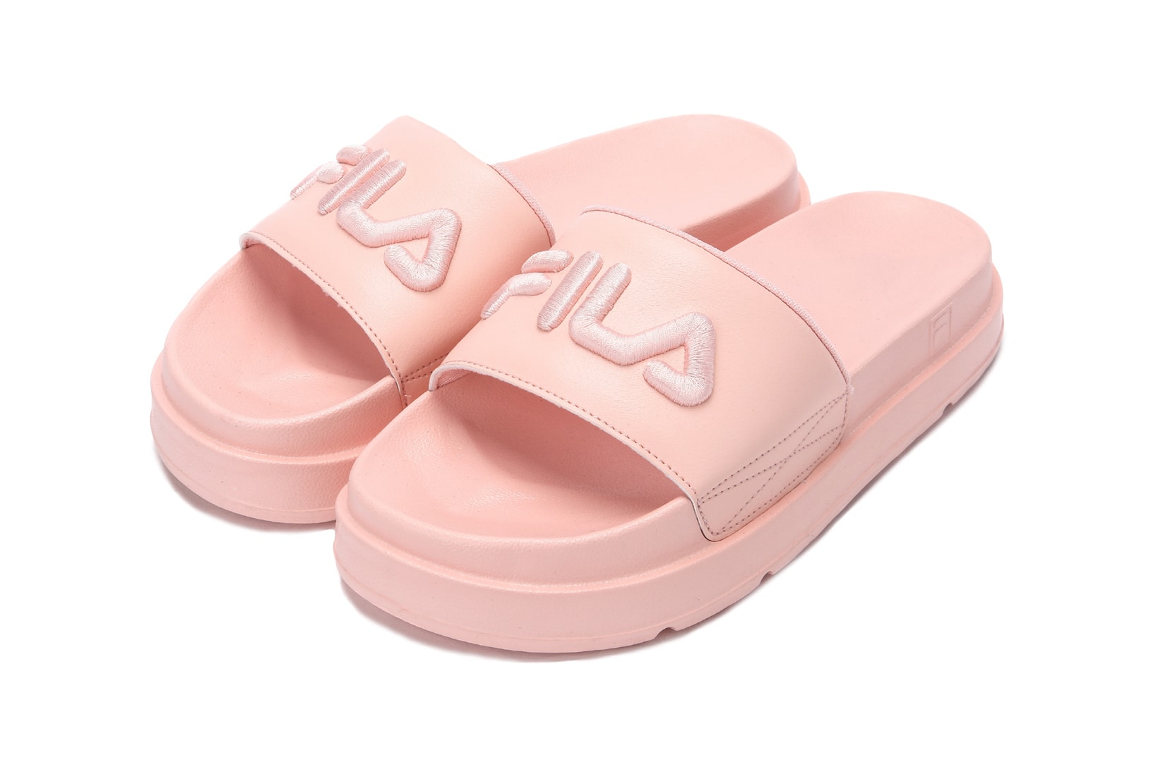 FILA logo millennial pastel pink platform slides drifter jacked up black white summer footwear where to buy