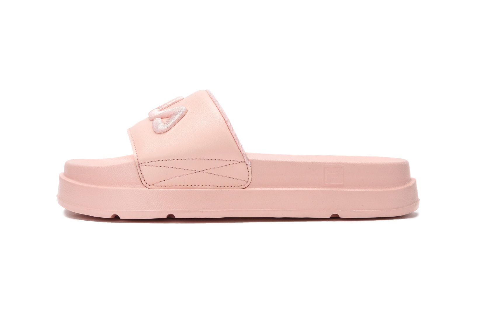 FILA logo millennial pastel pink platform slides drifter jacked up black white summer footwear where to buy