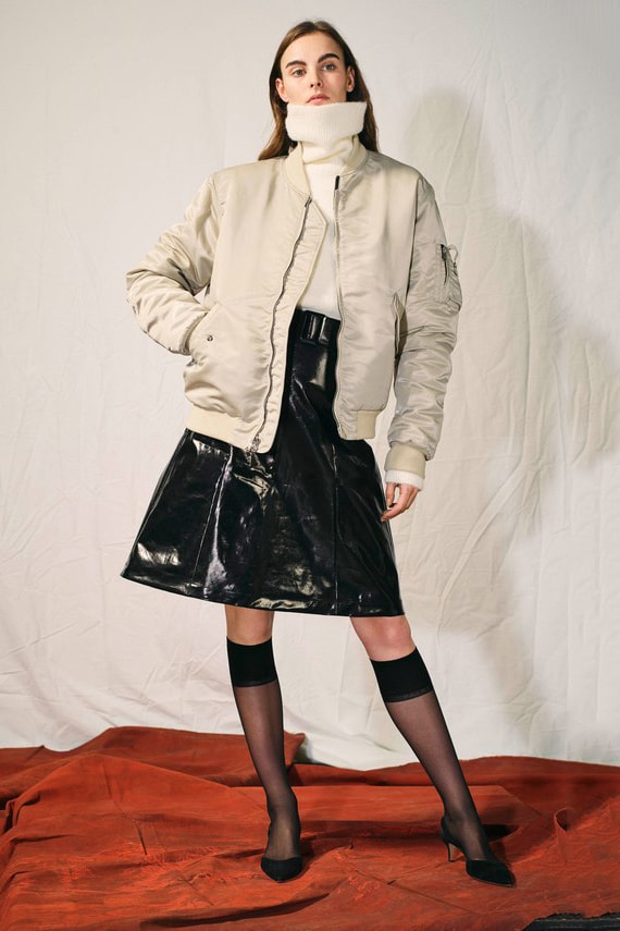 John Elliott Announces Women's Collection New York Fashion Week 2018 White Turtleneck Grey Bomber Black Vinyl Skirt