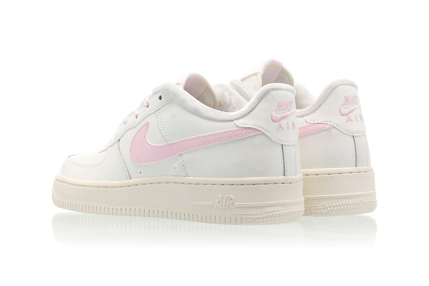 white nike air force 1 with pink swoosh