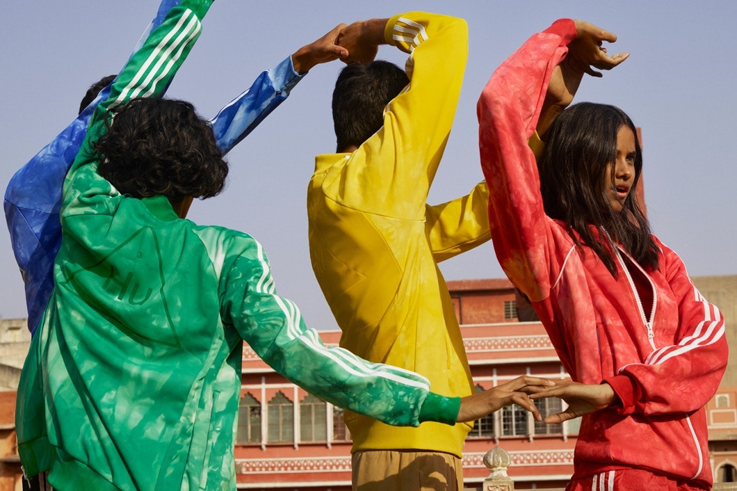 Pharrell williams adidas originals hu holi adicolor collection india hindu festival powder dye apparel stan smith tennis sneakers where to buy