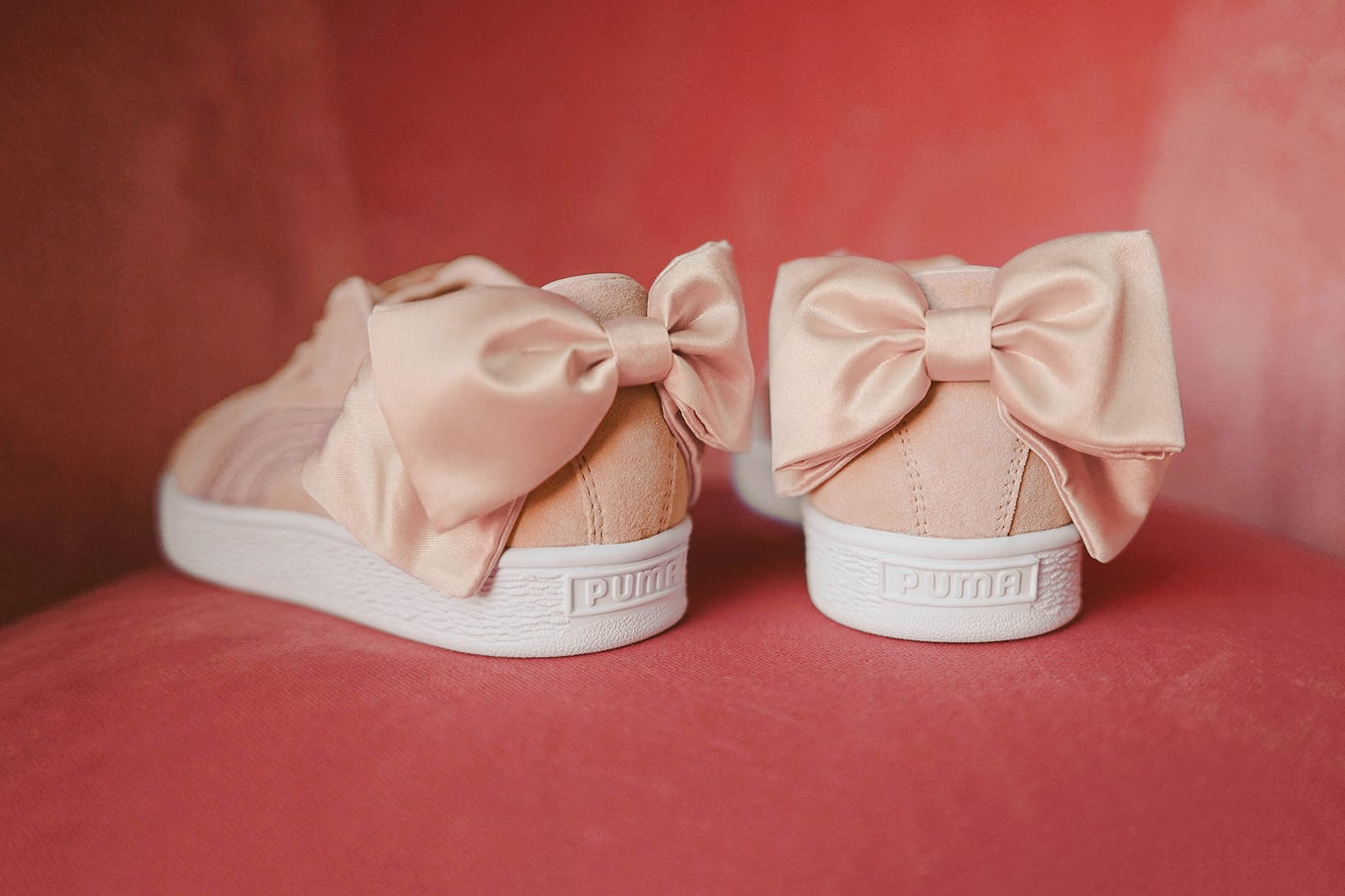puma pink sneakers with bow