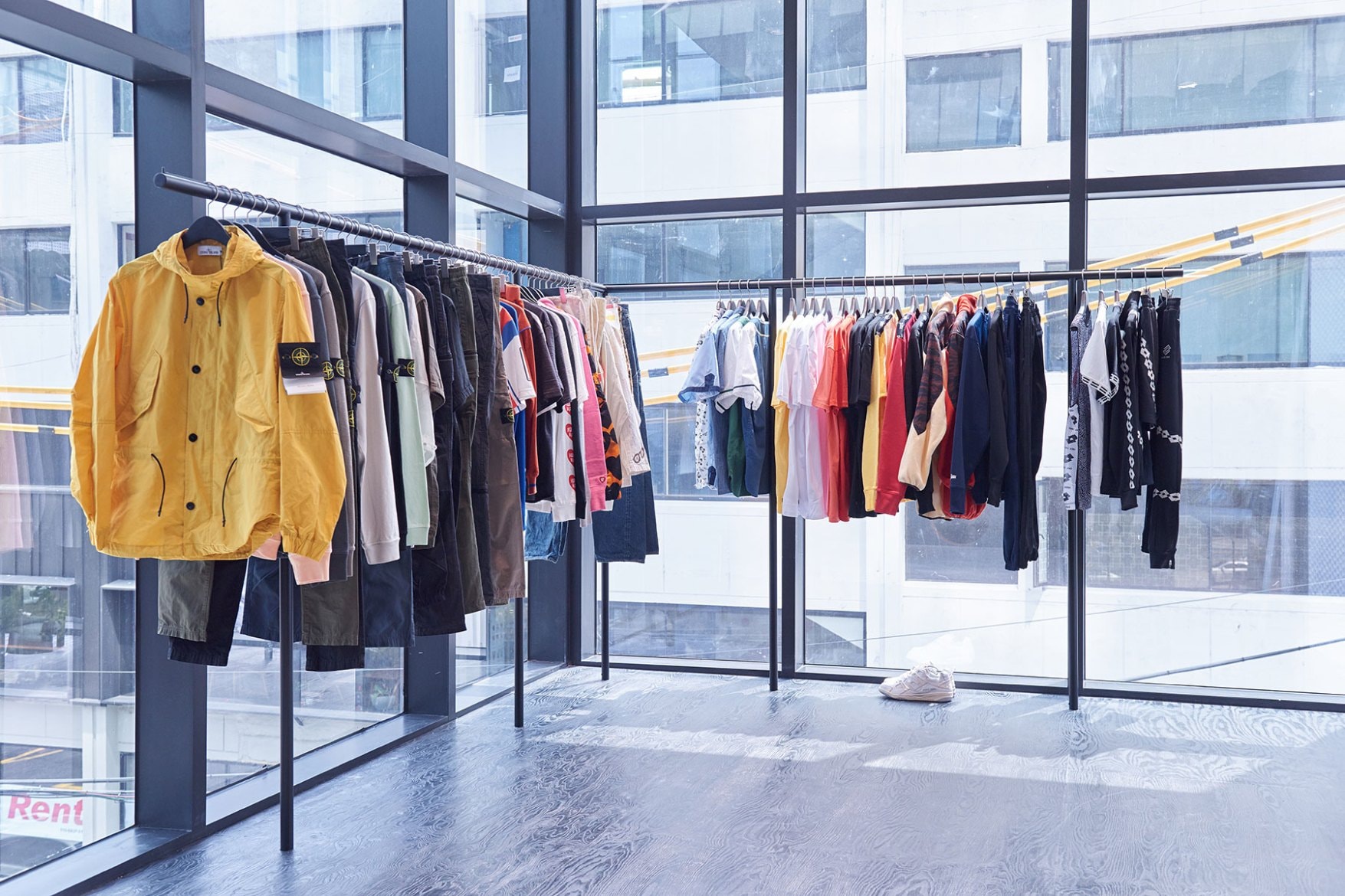 worksout hongdae seoul select shop streetwear collaborations windows clothing racks yellow jacket stone island