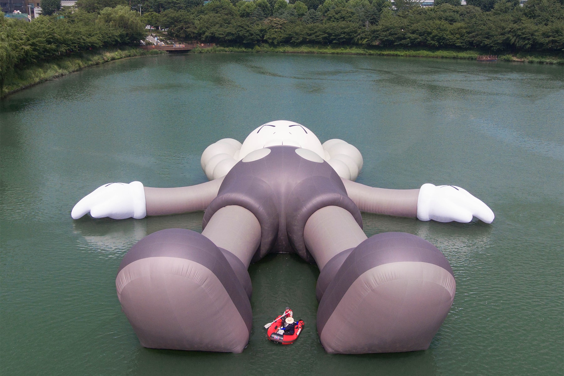 kaws holiday giant floating figure public art seokchon lake