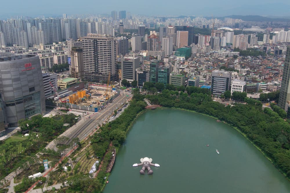 kaws holiday giant floating figure public art seokchon lake