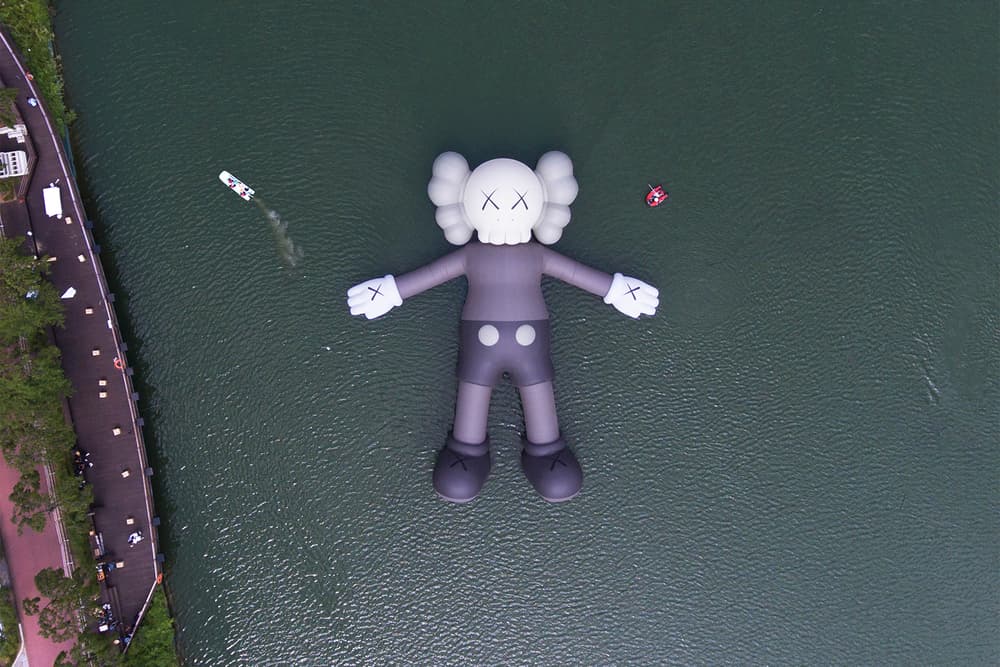kaws holiday giant floating figure public art seokchon lake