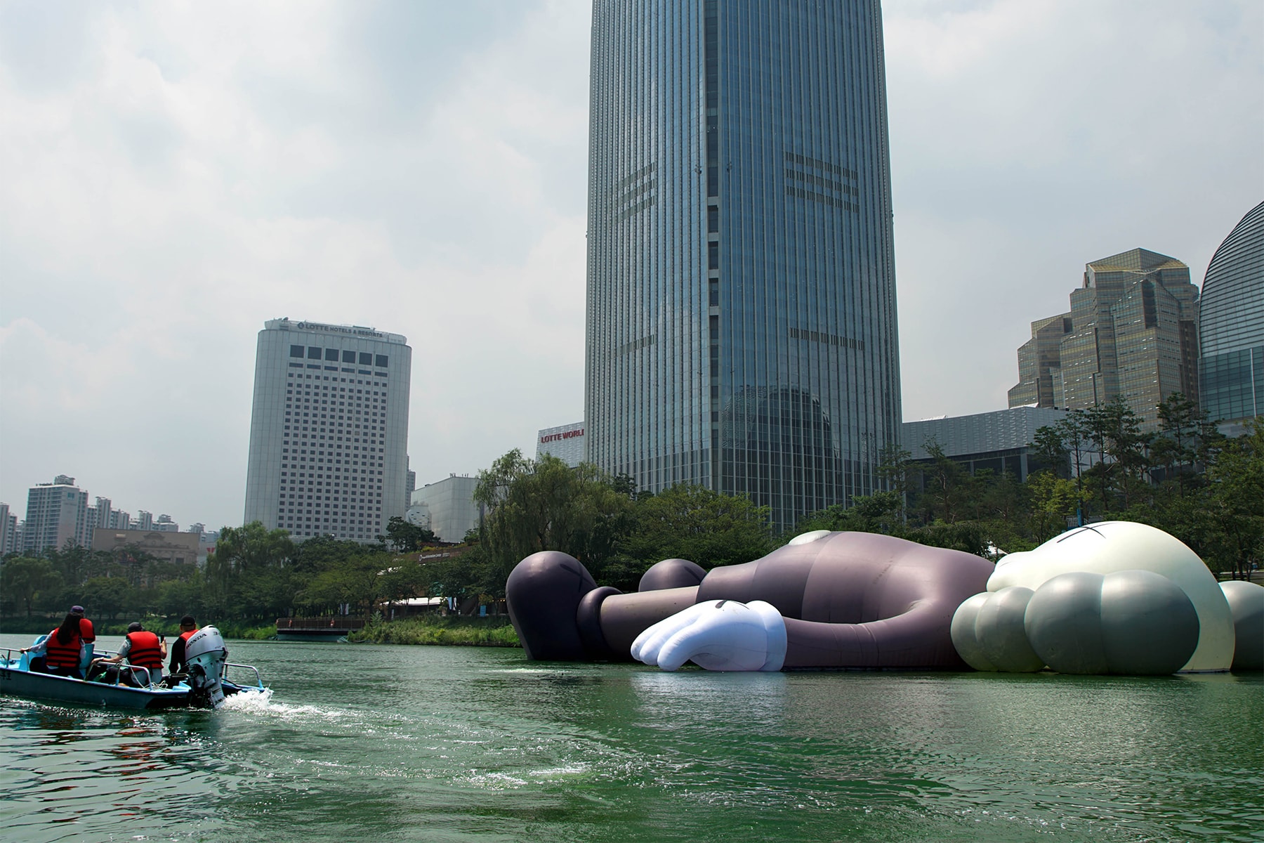 kaws holiday giant floating figure public art seokchon lake