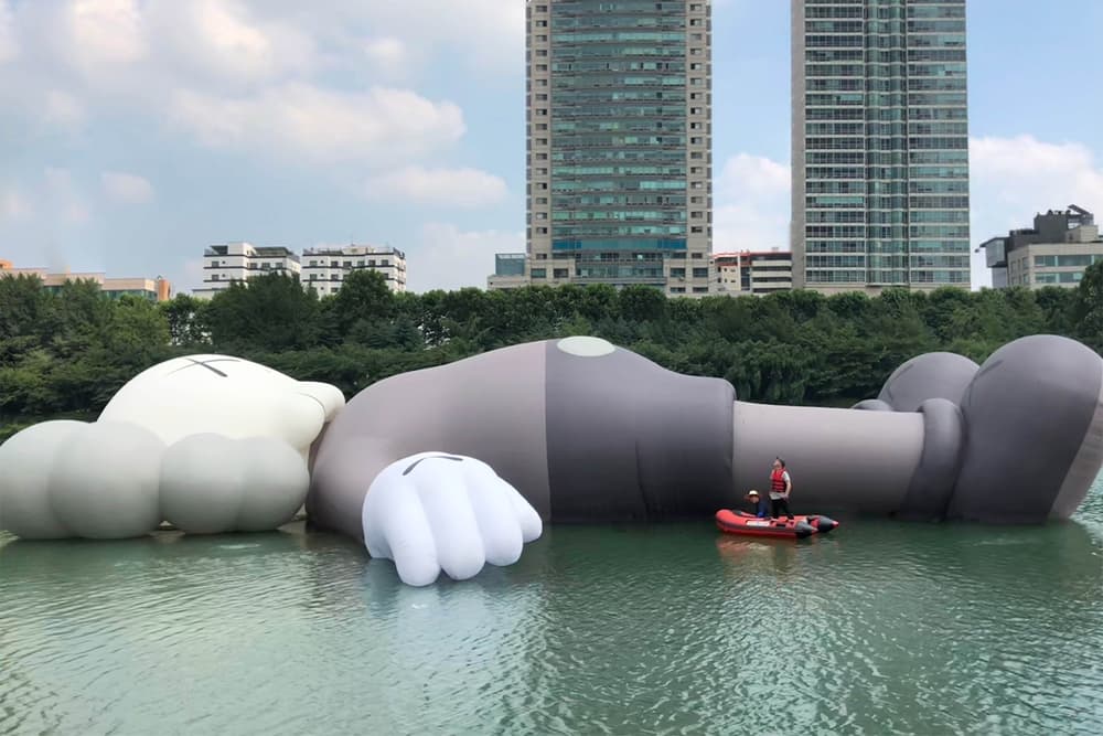 kaws holiday giant floating figure public art seokchon lake