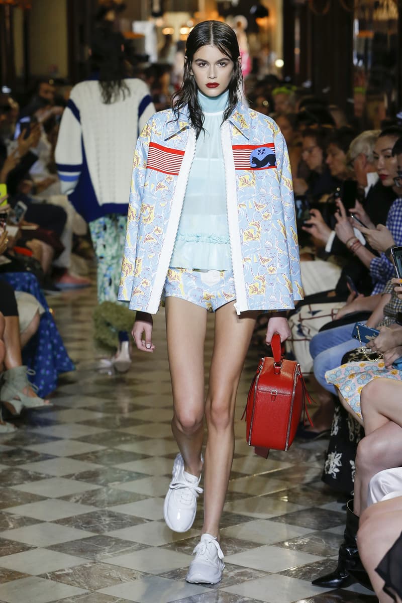 Kaia Gerber Miu Miu Resort 2019 Show Jacket White Blue Handbag Red