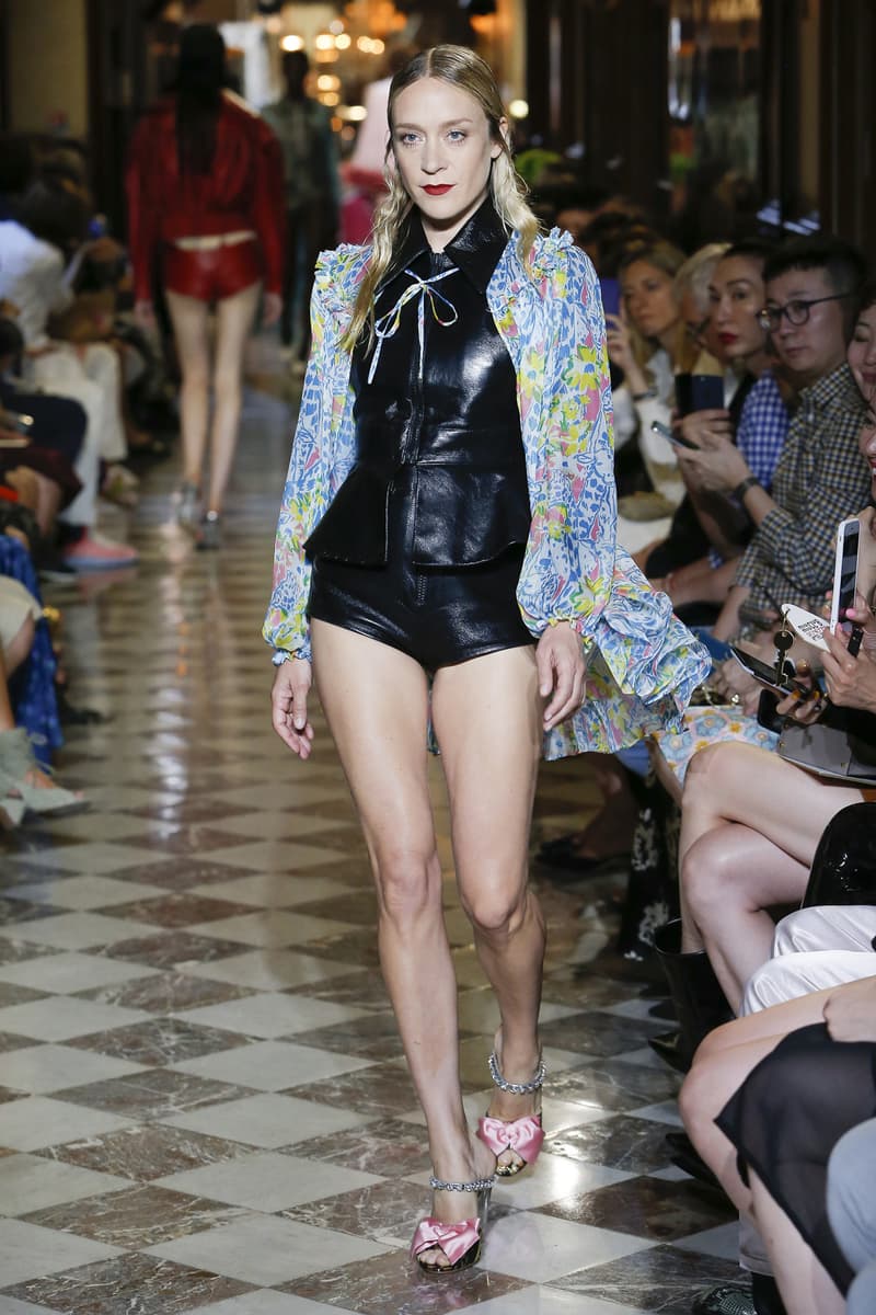 Chloe Sevigny Miu Miu Resort 2019 Show Floral Cardigan Yellow Blue Leather Top Shorts Black