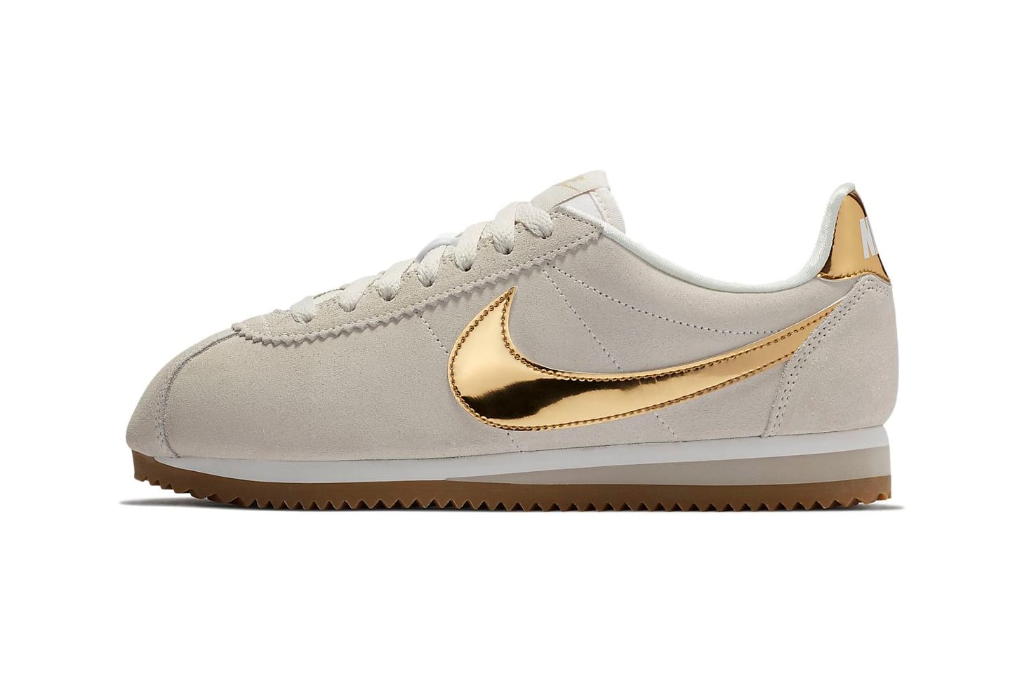 gold and white nike cortez