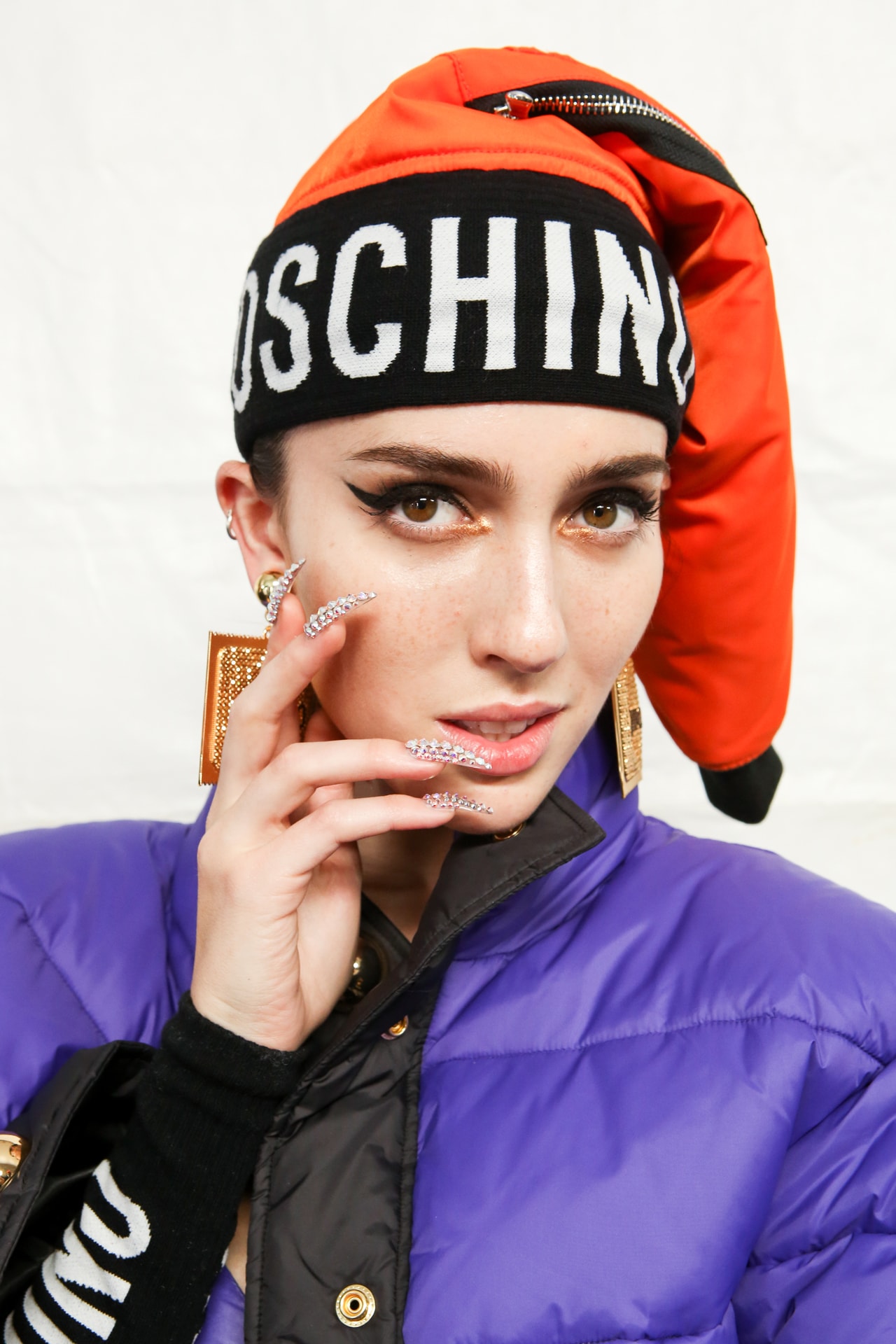 Moschino x H&M Collection Backstage Look Hat Orange Black Coat Purple