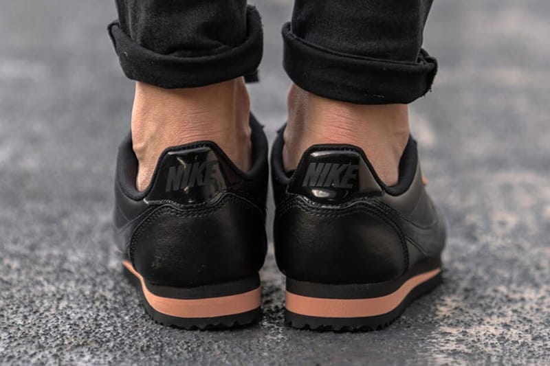 nike cortez trainers in black and rose gold