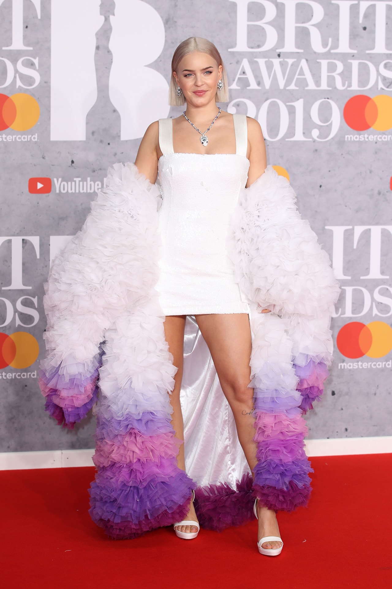 Anne Marie Brit Awards 2019 Red Carpet White Dress Purple Ombre Coat Ruffles