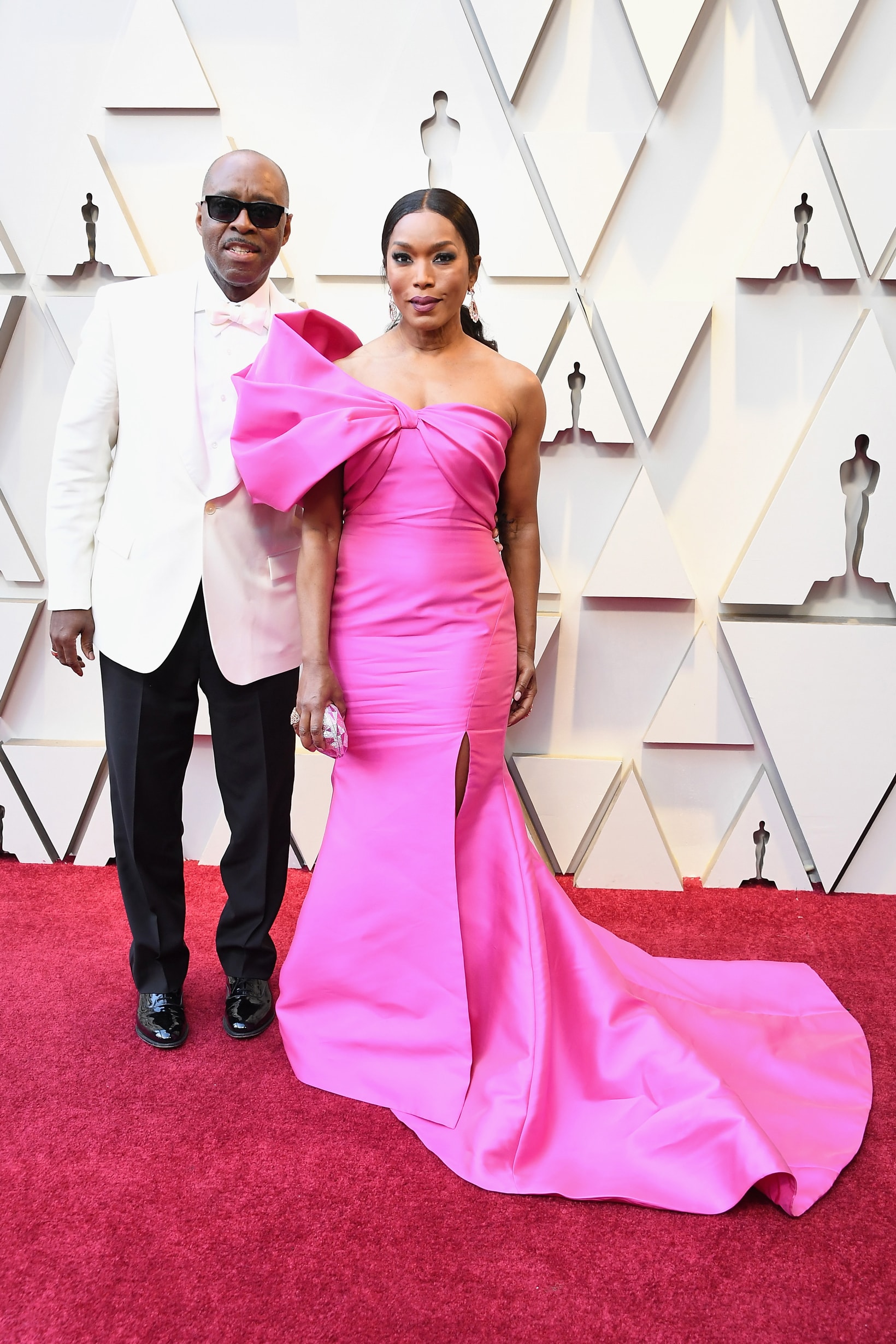 2019 Oscars Red Carpet Angela Bassett Reem Acra Dress Pink Courtney B. Vance Suit White Black