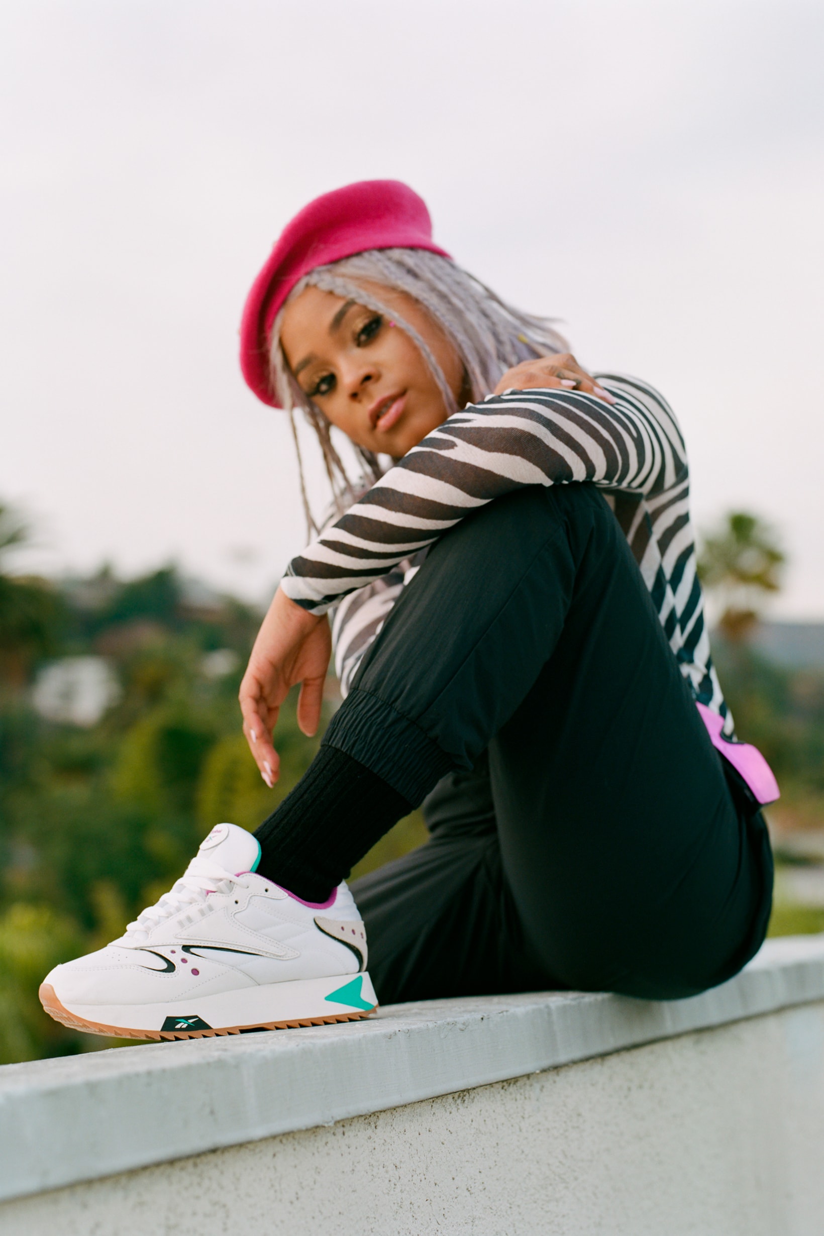Reebok Spring Summer 2019 Alter the Icons Campaign Tayla Parx Pants Black Zebra Top White Classic Leather ATI 90s Multicolor Hat Pink