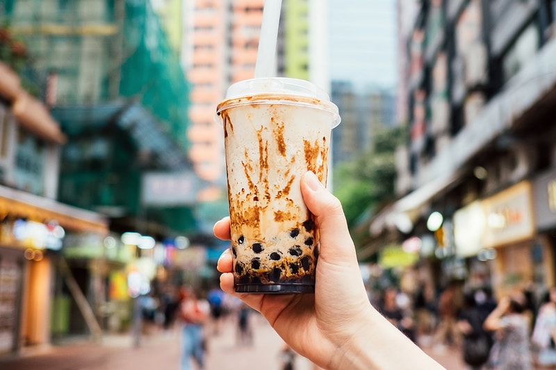 Bubble Tea Tapioca Milk Pearls Brown Sugar Hong Kong Street Taiwanese Drink Beverage Ice Cold Straw Plastic Cup Hand Holding