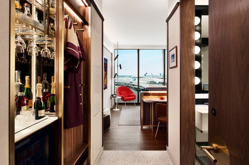 TWA Hotel JFK Airport New York Room Walls Brown Cream Chair Red