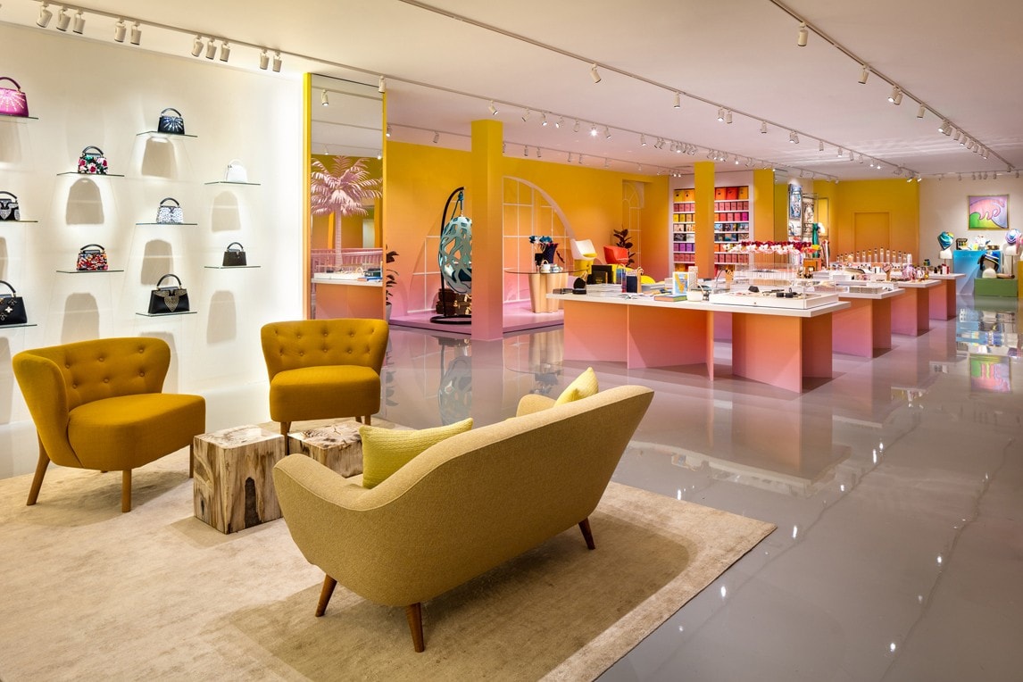 Louis Vuitton X Exhibition Los Angeles Room Couches Rug Yellow Table Pink