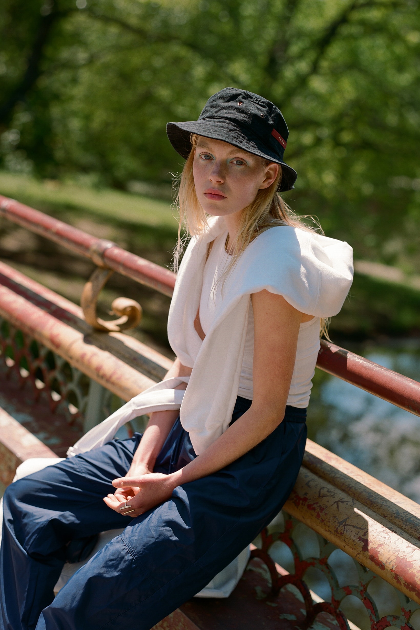 The Concept NY Vintage Summer Editorial Prada Bucket Hat Black Shirt White Sweatpants Blue