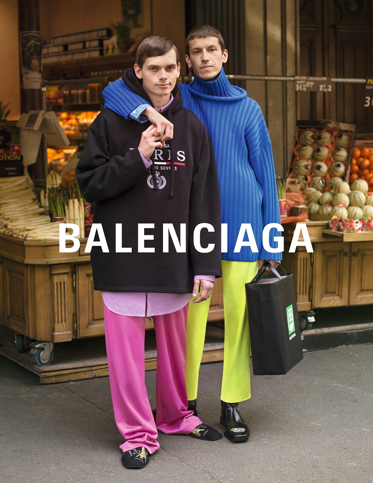 balenciaga winter campaign photos couple cobalt blue sweater lime pants pink black hoodie