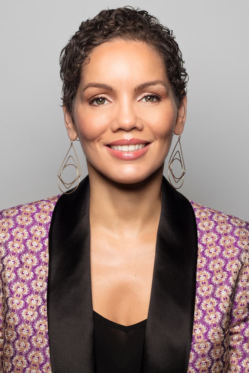 gucci Renée E. Tirado Global Head of Diversity Equity Inclusion earrings makeup curly hair lip gloss