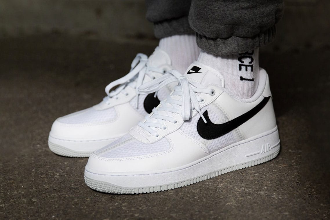 nike air forces with black swoosh