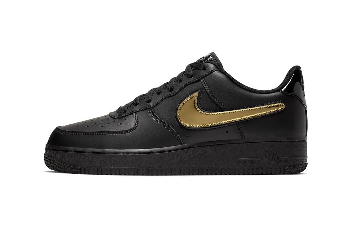 black nike shoes with gold swoosh