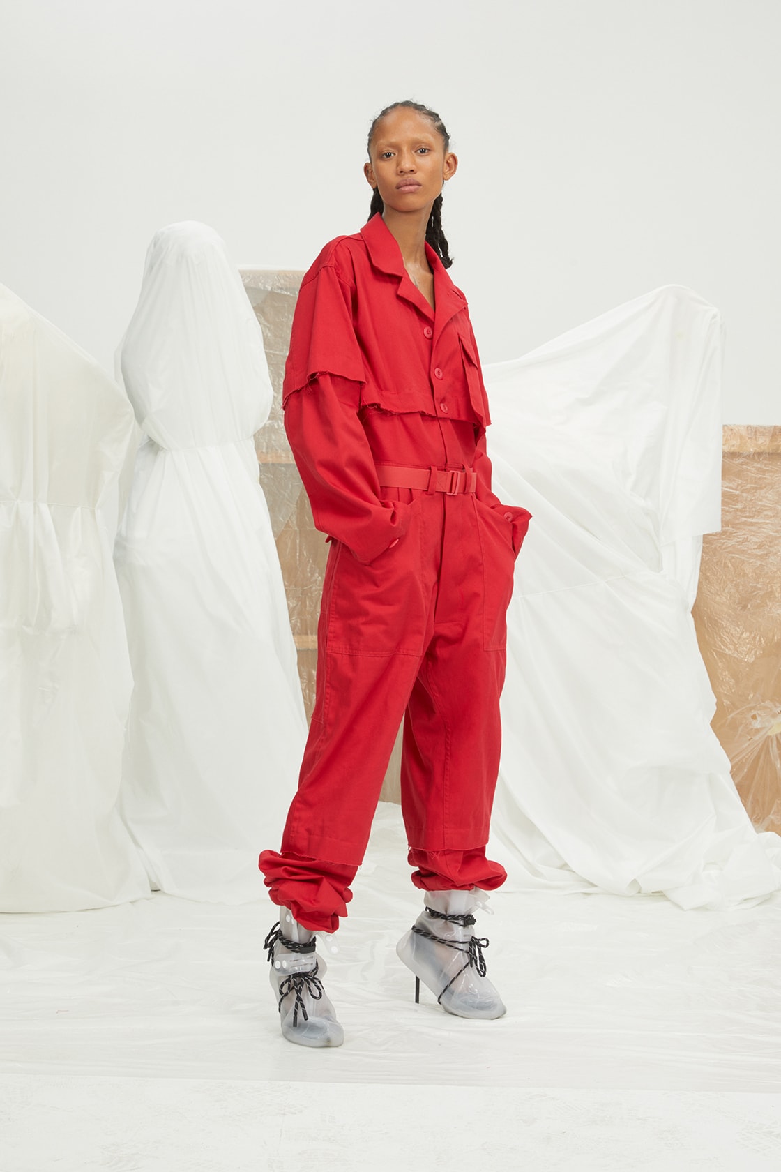perfect number woman on pedastal Adesuwa Aighewi red flightsuit