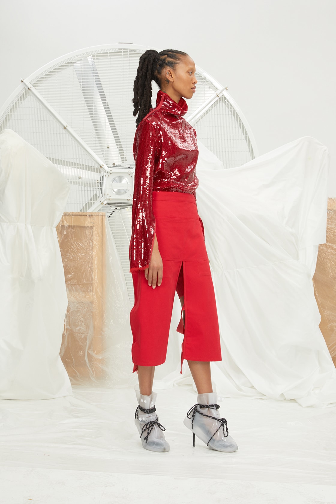 perfect number woman on pedastal Adesuwa Aighewi red sequin shirt pants