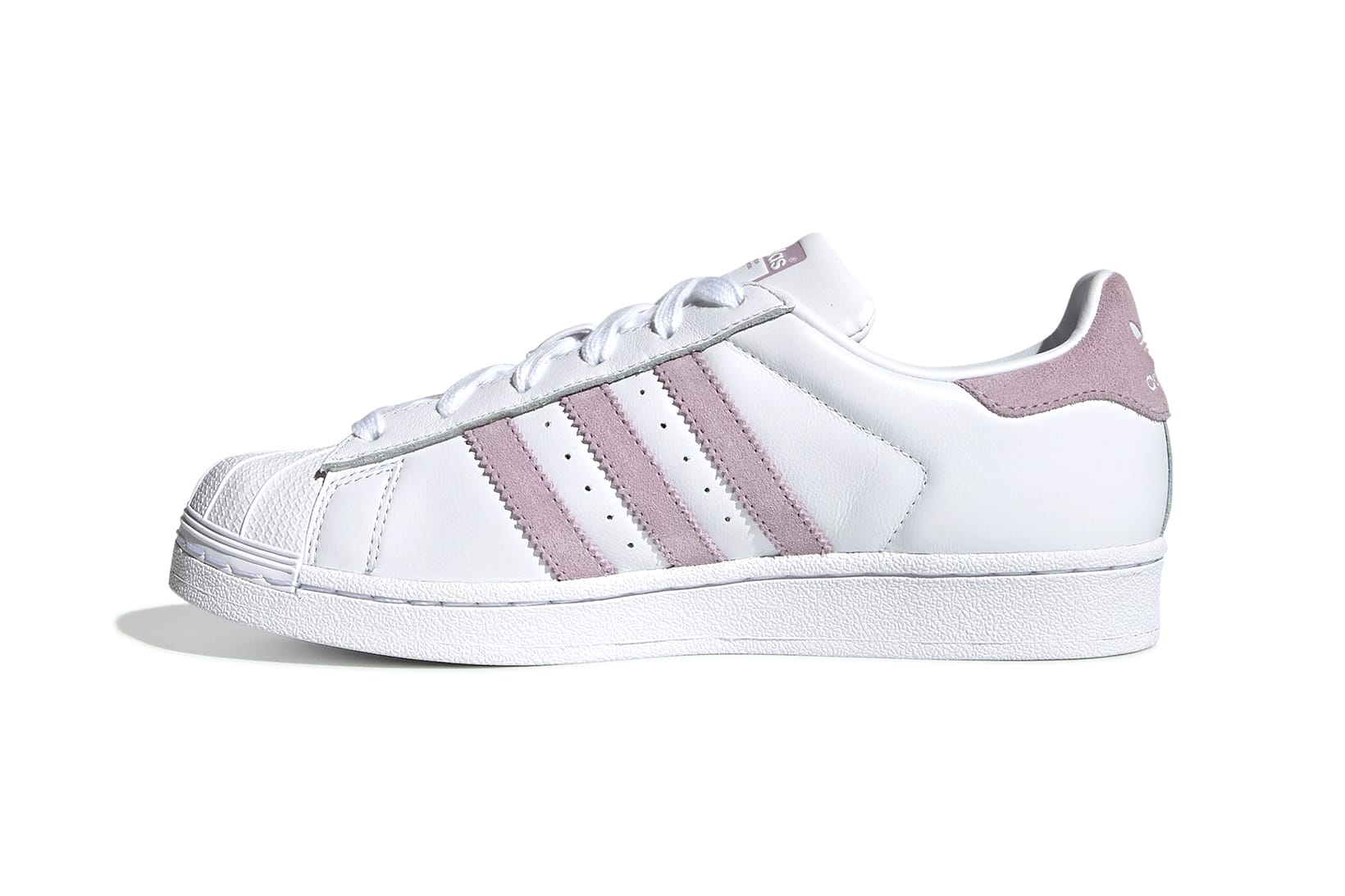white adidas trainers with pink stripes