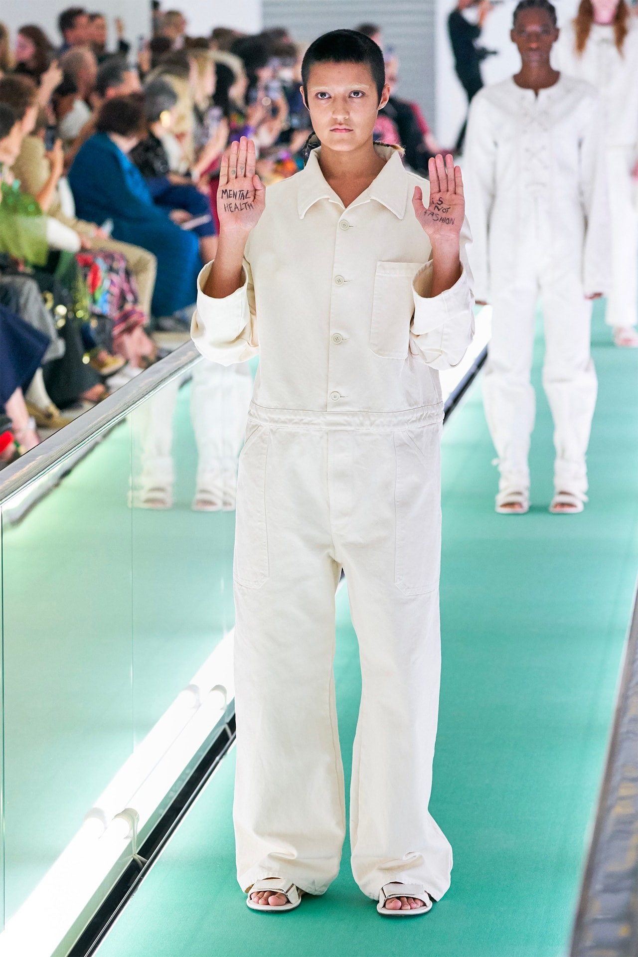 Gucci Model Yaya Bones Ayesha Tan Jones Mental Health Is Not Fashion Protest Hands Palms Spring Summer 2020 SS20 Catwalk Runway straitjacket