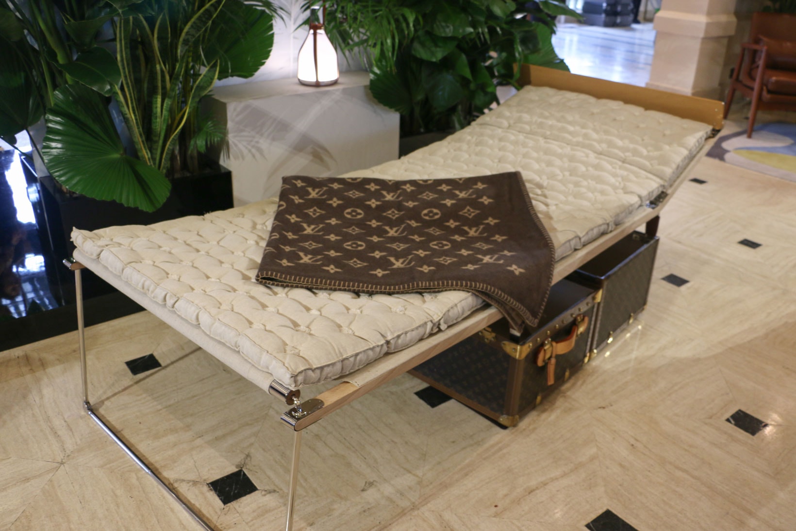 Louis Vuitton Hard Sided Trunks Preview Entrance Couch Blanket Grey Brown