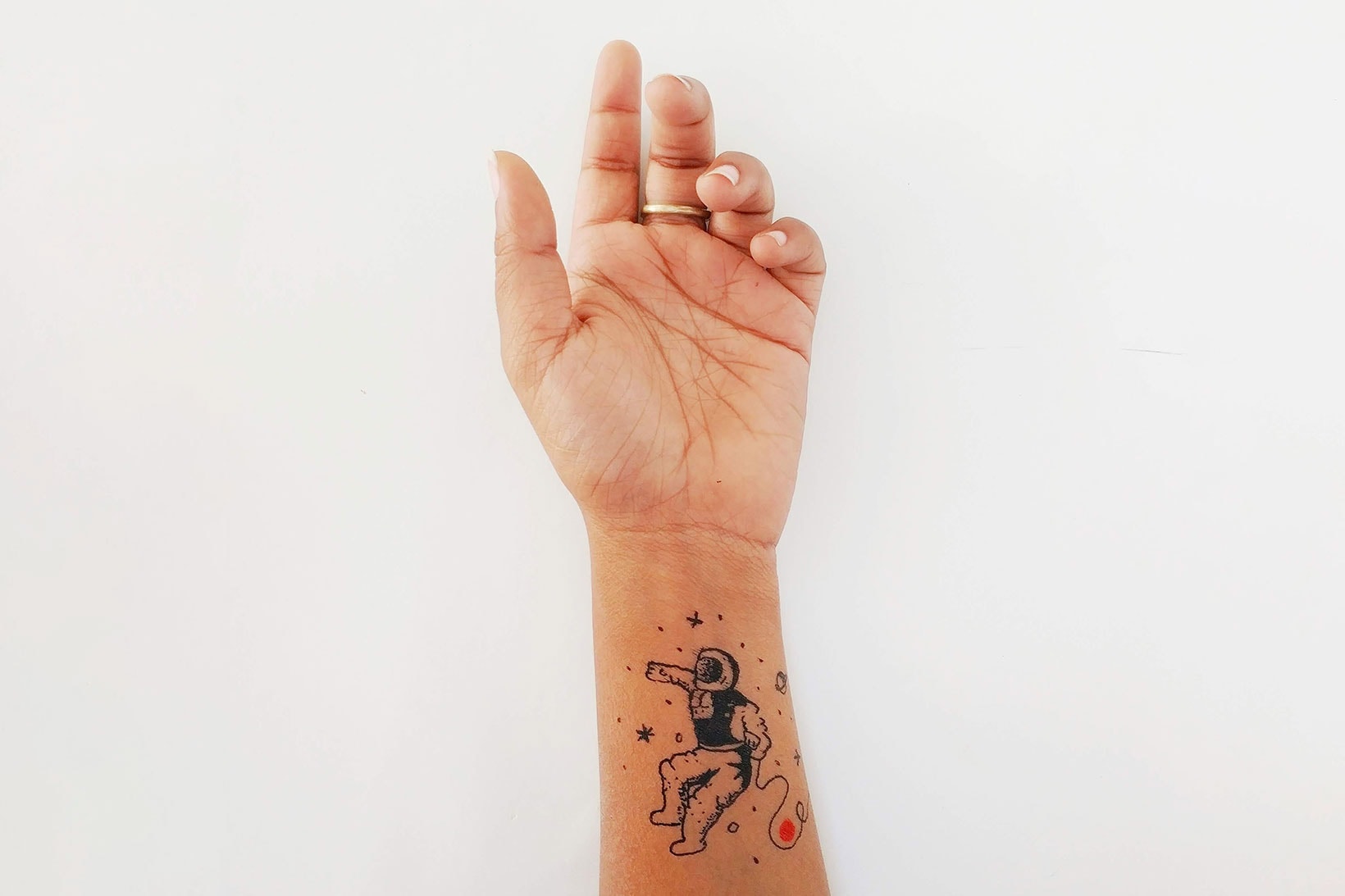 tattoo artist hand arm minimal astronaut art design chicago tattoo artists studios art 