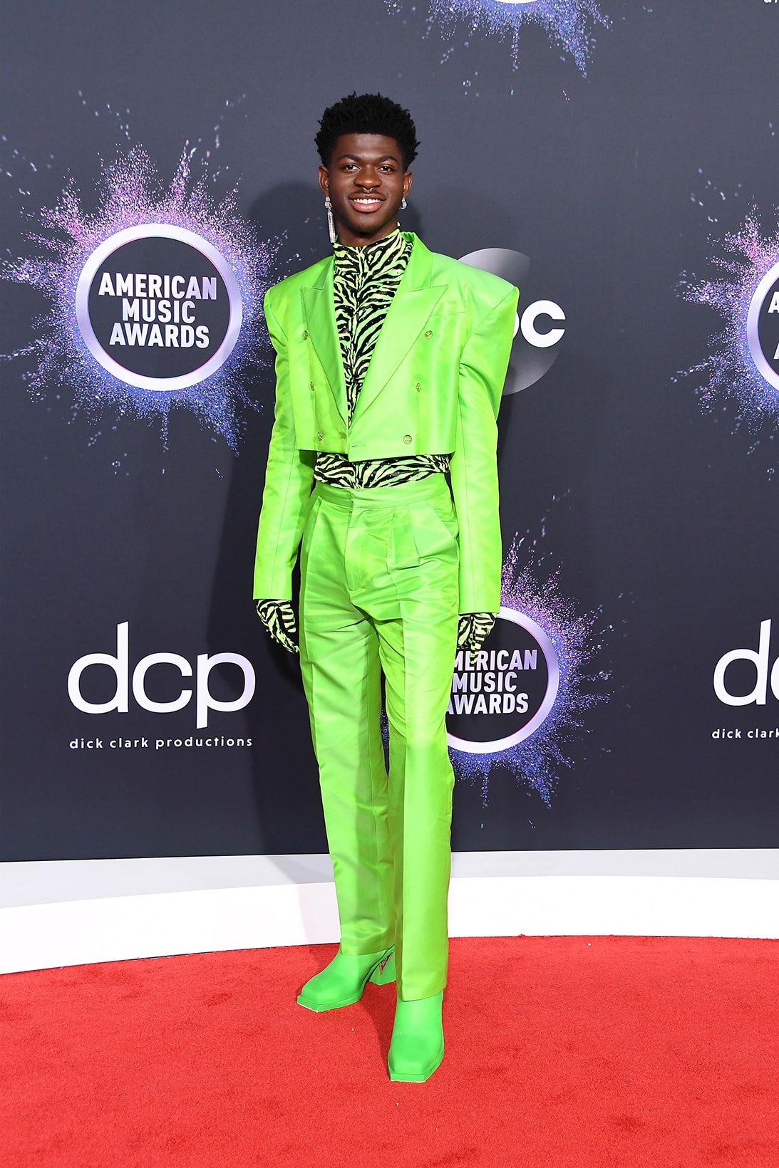 american music awards amas best celebrity red carpet looks lil naz x neon green suit zebra pattern boots
