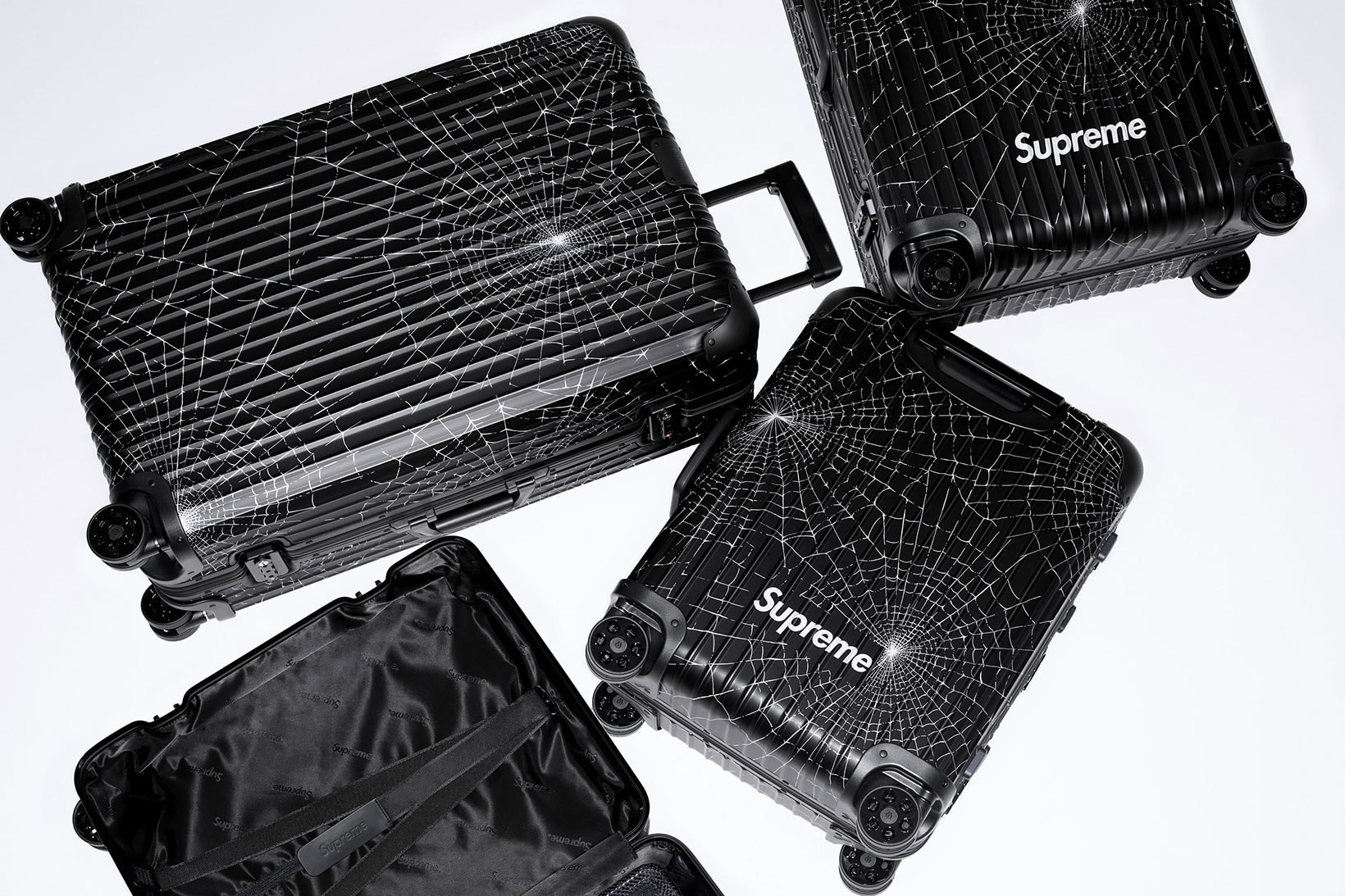 A PAIR OF LIMITED EDITION RED ALUMINUM SUITCASES, RIMOWA X SUPREME