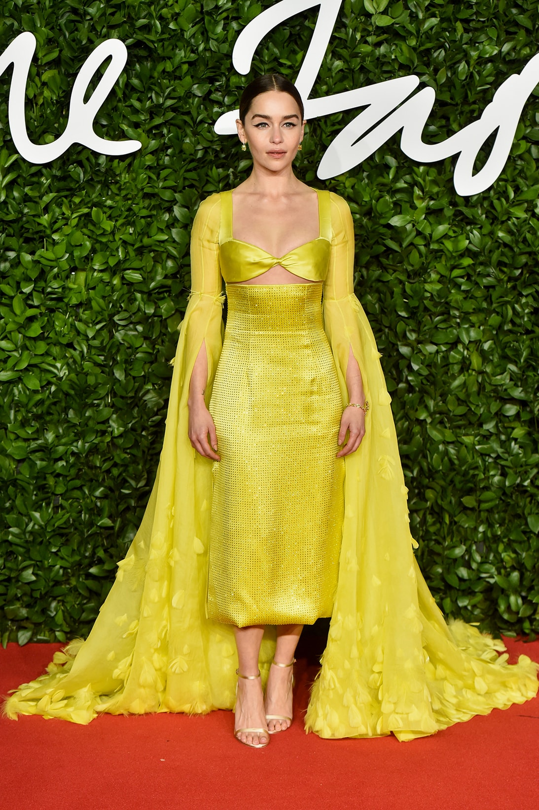 british fashion awards bfas best celebrity red carpet looks emilia clarke yellow gown dress